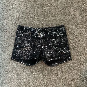 Black shorts with silver splatters (part of look)